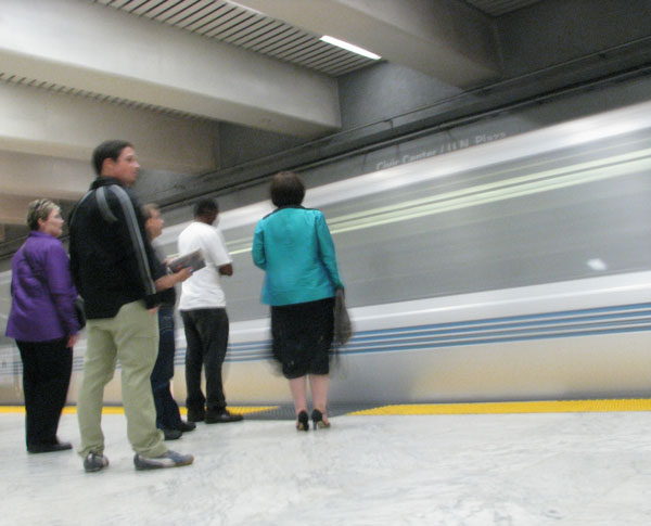 Passengers waiting for a train at the Civic Center BART Station